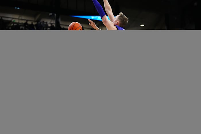 Dec 29, 2023; Boulder, Colorado, USA; Colorado Buffaloes guard KJ Simpson (2) shoots the ball past Washington Huskies forward Moses Wood (13) in the second half at the CU Events Center